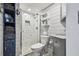 Modern bathroom with stylish vanity, new toilet, and walk-in shower with elegant tile work at 16106 6Th E St, Redington Beach, FL 33708