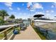 Private boat dock with boat lift and seating, offering direct access to waterfront activities at 16106 6Th E St, Redington Beach, FL 33708