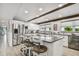 Open kitchen featuring a large island with seating, stainless steel appliances, and plenty of counter space at 16106 6Th E St, Redington Beach, FL 33708