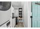 Clean and organized laundry room with front loading washer/dryer and ample storage at 16106 6Th E St, Redington Beach, FL 33708