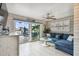 Inviting living room with a comfortable sofa and sliding doors to the waterfront patio at 16106 6Th E St, Redington Beach, FL 33708