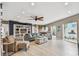 Inviting living room featuring wood-look floors, stylish furnishings, and natural light streaming through the windows at 16106 6Th E St, Redington Beach, FL 33708