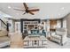 Spacious living room with open floor plan, bookshelf, ceiling fan and comfortable seating at 16106 6Th E St, Redington Beach, FL 33708
