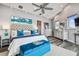 Relaxing main bedroom with a seating area, stylish decor, and plenty of natural light at 16106 6Th E St, Redington Beach, FL 33708