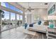Serene main bedroom with waterfront views, a cozy rug, and a sliding barn door at 16106 6Th E St, Redington Beach, FL 33708