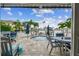 Beautiful outdoor patio with a spa, a waterfront view, and outdoor furniture at 16106 6Th E St, Redington Beach, FL 33708