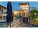 Covered outdoor patio with private pool, dining and lounge seating, and a firepit, creating a perfect entertainment space at 16106 6Th E St, Redington Beach, FL 33708