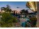 The backyard patio features palm trees, outdoor seating, and a small in-ground pool at 16106 6Th E St, Redington Beach, FL 33708