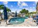 Beautiful backyard pool area with patio, dock, and waterfront views; ideal for entertaining at 16106 6Th E St, Redington Beach, FL 33708
