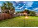 A well-maintained backyard with a fire pit at 1910 Montego Ct, Oldsmar, FL 34677