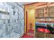 Bathroom features a modern glass shower with an eye-catching sink and vanity area at 1910 Montego Ct, Oldsmar, FL 34677