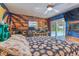 Unique bedroom featuring an accent wall with shelving and a sliding glass door to the pool area at 1910 Montego Ct, Oldsmar, FL 34677
