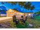 Exterior elevation featuring front yard patio with table and chairs at 1910 Montego Ct, Oldsmar, FL 34677
