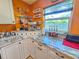 Close-up of countertop featuring an espresso machine, glass shelves, and white cabinets at 1910 Montego Ct, Oldsmar, FL 34677