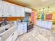 Kitchen view with white cabinets, stainless steel appliances, and stone tile floors at 1910 Montego Ct, Oldsmar, FL 34677