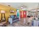 Bright living room featuring colorful walls, tile flooring, and ample natural light at 1910 Montego Ct, Oldsmar, FL 34677