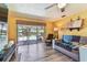 Cozy living room with sliding door access to the outdoor pool area at 1910 Montego Ct, Oldsmar, FL 34677