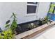 This outdoor pond is surrounded by lush plants and brick trim, adding to the home's character at 1910 Montego Ct, Oldsmar, FL 34677