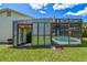 Features a screened-in pool with a storage shed adjacent to it at 1910 Montego Ct, Oldsmar, FL 34677