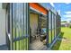 Open storage shed with corrugated metal walls, adjacent to pool at 1910 Montego Ct, Oldsmar, FL 34677