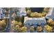 Aerial of townhome featuring gray roof and a location near a pond, nestled within a well-maintained community at 19232 Stone Hedge Dr, Tampa, FL 33647