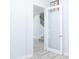 Entryway showing the interior with wood-look floors, stairs, and white walls at 19232 Stone Hedge Dr, Tampa, FL 33647