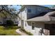 The building's exterior showcases white trim, manicured landscaping, and mature landscaping at 19232 Stone Hedge Dr, Tampa, FL 33647