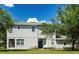 Charming townhome with well-maintained lawn, white-framed windows, and a dark blue front door beneath a covered entry at 19232 Stone Hedge Dr, Tampa, FL 33647
