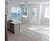 Open-concept kitchen and dining area features lots of natural light at 19232 Stone Hedge Dr, Tampa, FL 33647