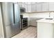 Modern kitchen featuring stainless steel appliances and light gray cabinets at 19232 Stone Hedge Dr, Tampa, FL 33647