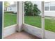 Enclosed patio area with brick flooring, offering a private outdoor space at 19232 Stone Hedge Dr, Tampa, FL 33647