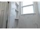 Clean, tiled shower stall with built-in shelves at 19232 Stone Hedge Dr, Tampa, FL 33647