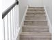 Staircase with hardwood treads and white risers at 19232 Stone Hedge Dr, Tampa, FL 33647