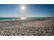 Expansive beach with shimmering water invites relaxation and leisurely strolls by the ocean at 19717 Gulf Blvd # V5, Indian Shores, FL 33785