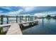 Well-maintained dock with boat lifts offering convenient access to the serene waters at 19717 Gulf Blvd # V5, Indian Shores, FL 33785
