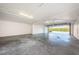 Spacious two car garage with concrete floors and white walls at 19717 Gulf Blvd # V5, Indian Shores, FL 33785