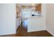 Inviting kitchen with white appliances, natural wood cabinets, breakfast bar, and tile flooring with access to a dining area at 19717 Gulf Blvd # V5, Indian Shores, FL 33785