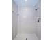 Clean shower featuring tiled walls and floor with shower head and fixtures at 19717 Gulf Blvd # V5, Indian Shores, FL 33785
