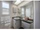 This bathroom boasts a granite-look vanity with a large mirror and vanity lighting at 208 Oakwood Blvd, Oldsmar, FL 34677