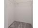 Walk-in closet with shelf and neutral carpet at 208 Oakwood Blvd, Oldsmar, FL 34677