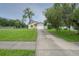 Charming single-story home with a well-manicured lawn and a one-car garage at 208 Oakwood Blvd, Oldsmar, FL 34677