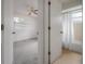 View of the hallway leading to a bedroom and bathroom, offering a glimpse into the well-maintained interior spaces at 208 Oakwood Blvd, Oldsmar, FL 34677