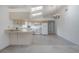 Bright kitchen with white appliances, light wood cabinets and vaulted ceilings with skylights at 208 Oakwood Blvd, Oldsmar, FL 34677