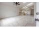 Open-concept floorplan featuring vaulted ceilings with skylights and a ceiling fan at 208 Oakwood Blvd, Oldsmar, FL 34677