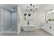 Elegant bathroom featuring a soaking tub, walk-in shower, and double vanity at 2272 Adam Ct, Palm Harbor, FL 34683