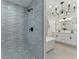 Stylish bathroom showcasing a modern walk-in shower, soaking tub, and double vanity at 2272 Adam Ct, Palm Harbor, FL 34683