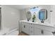 Bright bathroom featuring a double vanity with modern fixtures and decor at 2272 Adam Ct, Palm Harbor, FL 34683