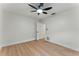 Bedroom boasts new flooring and a ceiling fan at 2272 Adam Ct, Palm Harbor, FL 34683