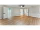 Spacious bedroom with hardwood floors, walk-in closet, multiple doors, and a ceiling fan at 2272 Adam Ct, Palm Harbor, FL 34683
