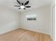 Bright bedroom with new flooring and trim, complemented by a modern ceiling fan at 2272 Adam Ct, Palm Harbor, FL 34683